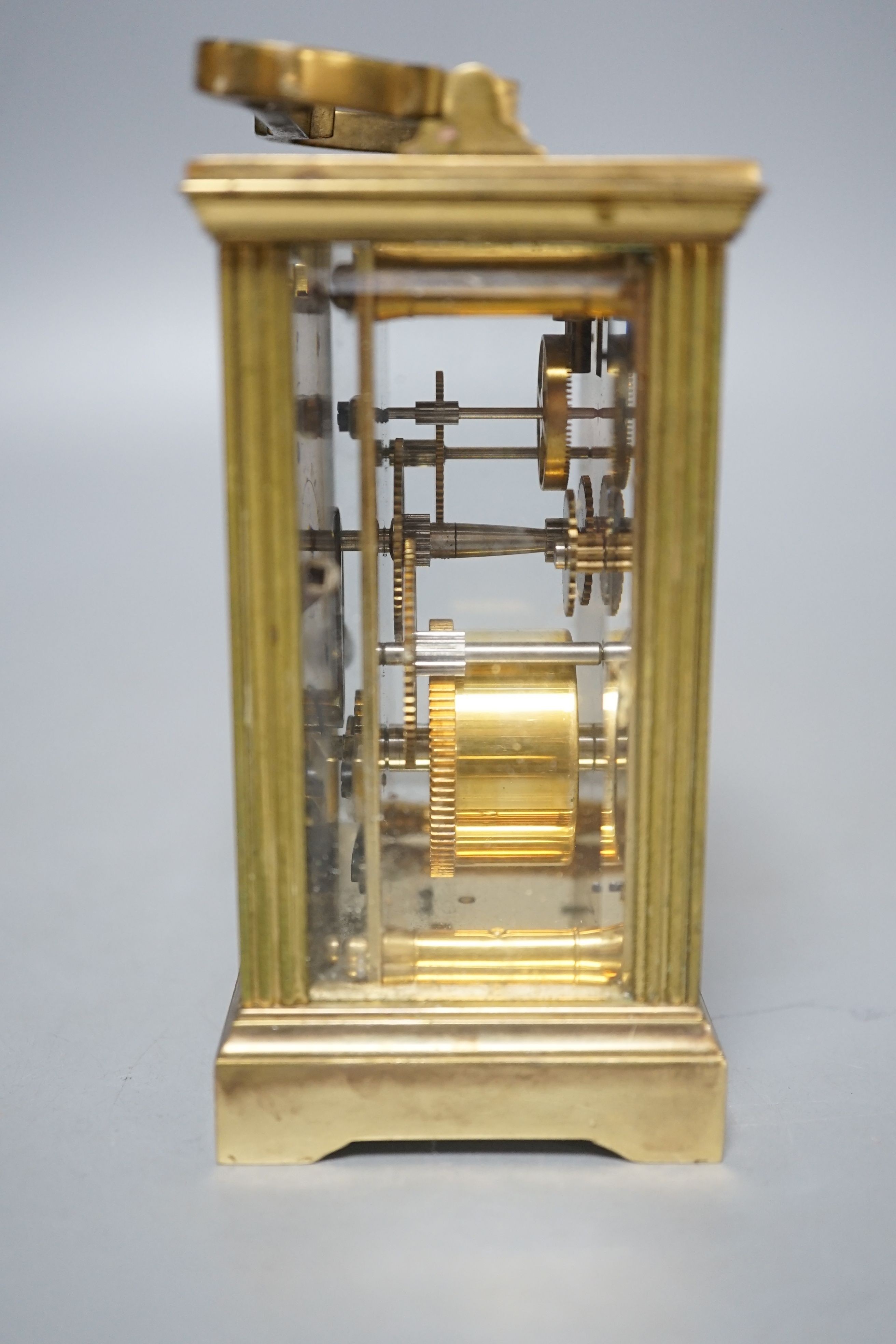 A French brass carriage timepiece, 11cms high.